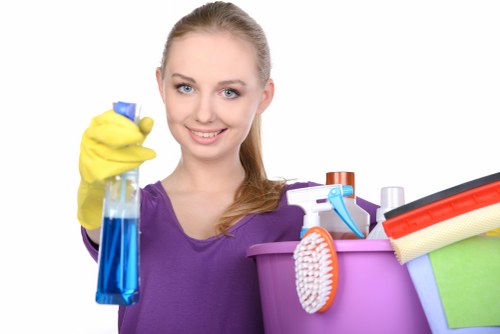 Local upholstery cleaner treating a fabric sofa in Wimbledon